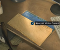 The blueprint's placement on the desk with the keyboard and computer