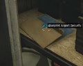 The blueprint's placement on the shelf behind the door